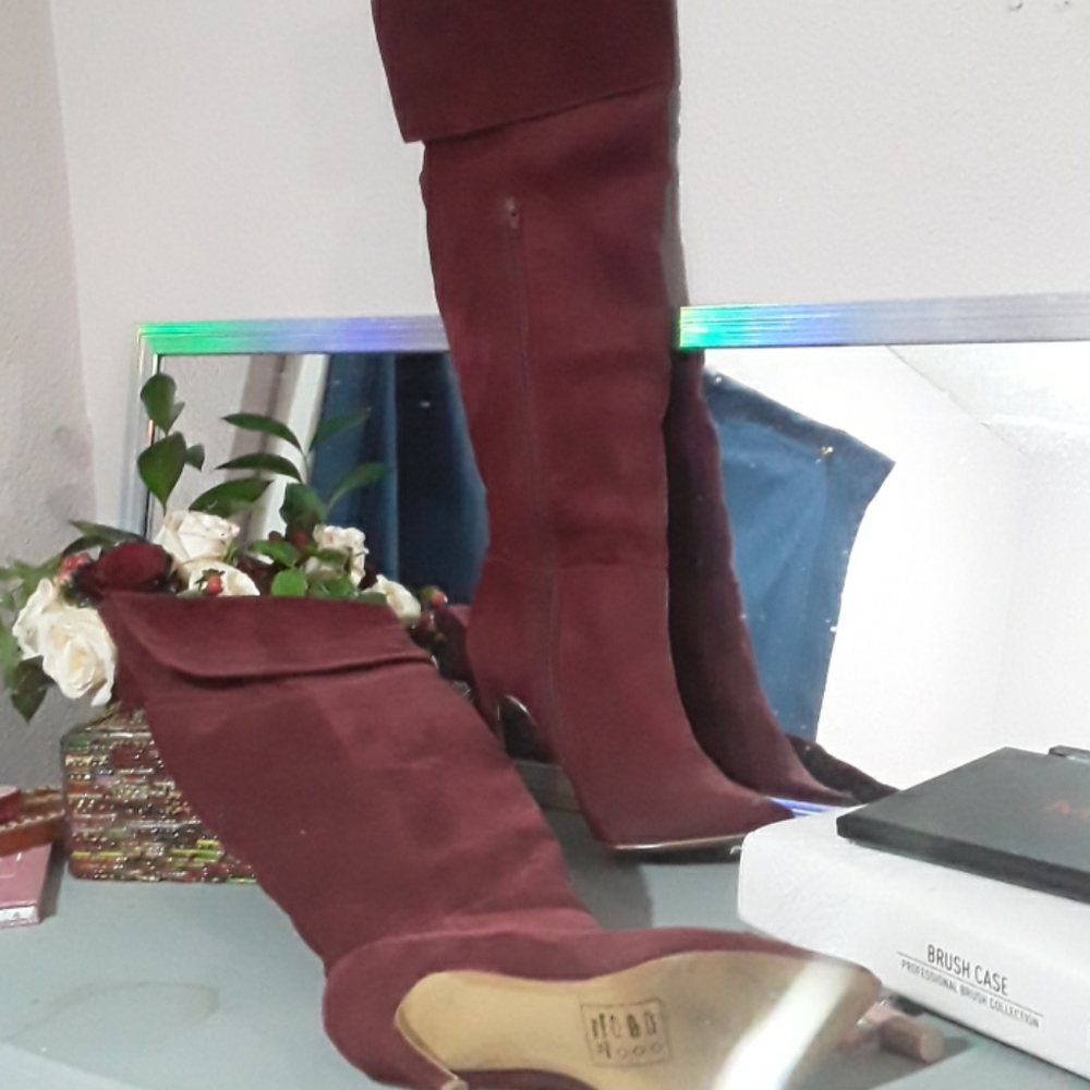 Thigh high red heeled boot